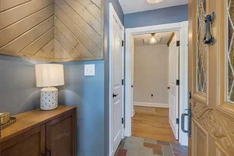 a view of balcony with chairs and wooden fence