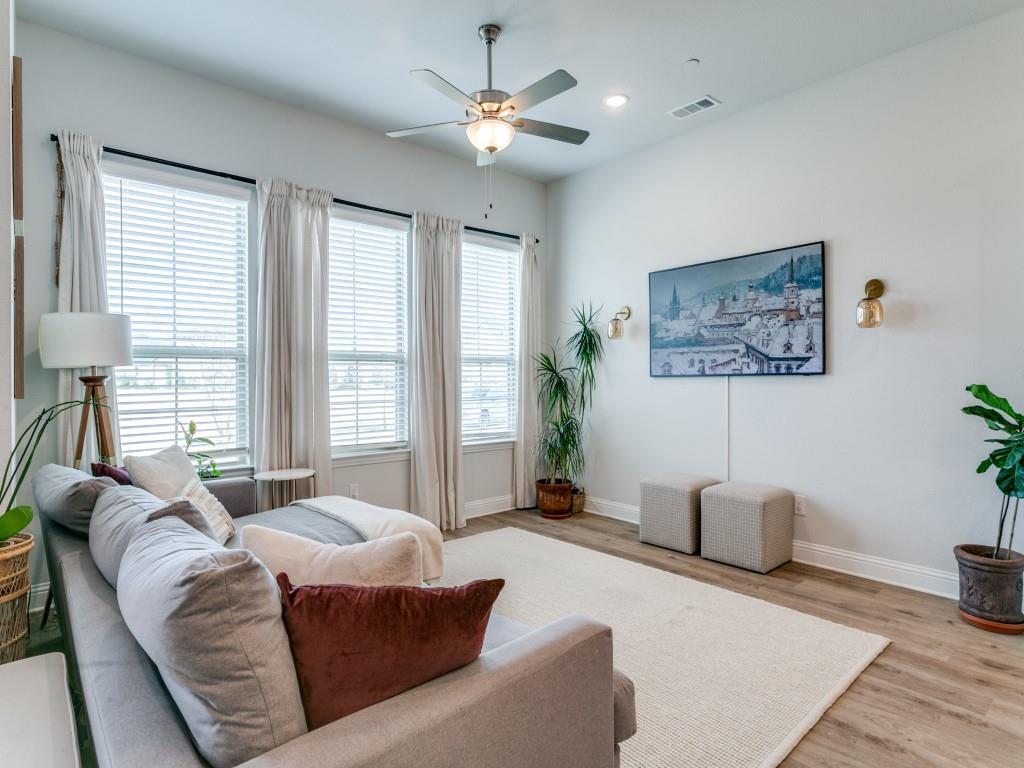 12964 Rockham Lane Dallas, TX 75234 - Photo 7 of 24 a living room with furniture and a large window