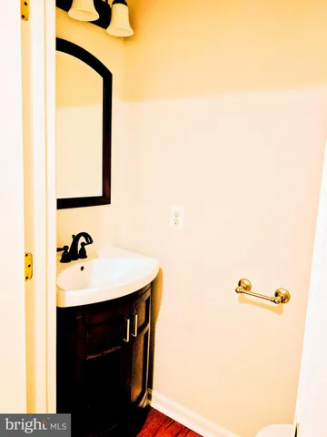 a bathroom with a sink and mirror