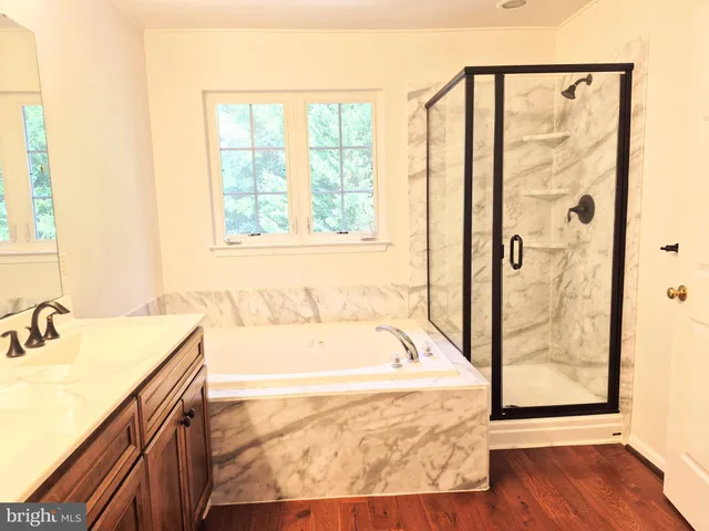 a bathroom with a tub and a sink