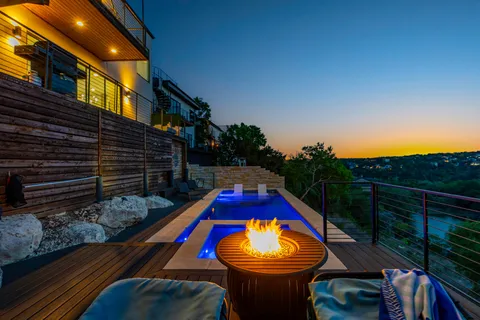a view of a wooden deck with a backyard