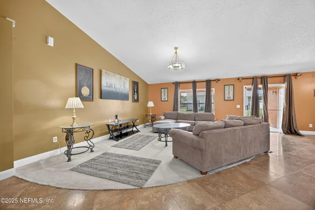 a front view of house with yard and trees