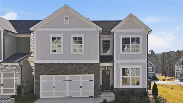 a front view of a house with a yard