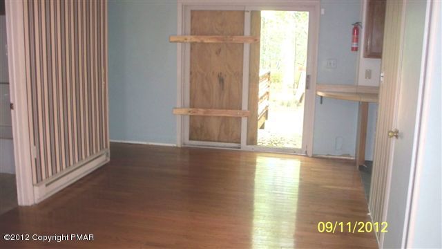 7036 Bull Road Long Pond, PA 18334 - Photo 3 of 7 a view of an empty room with a window