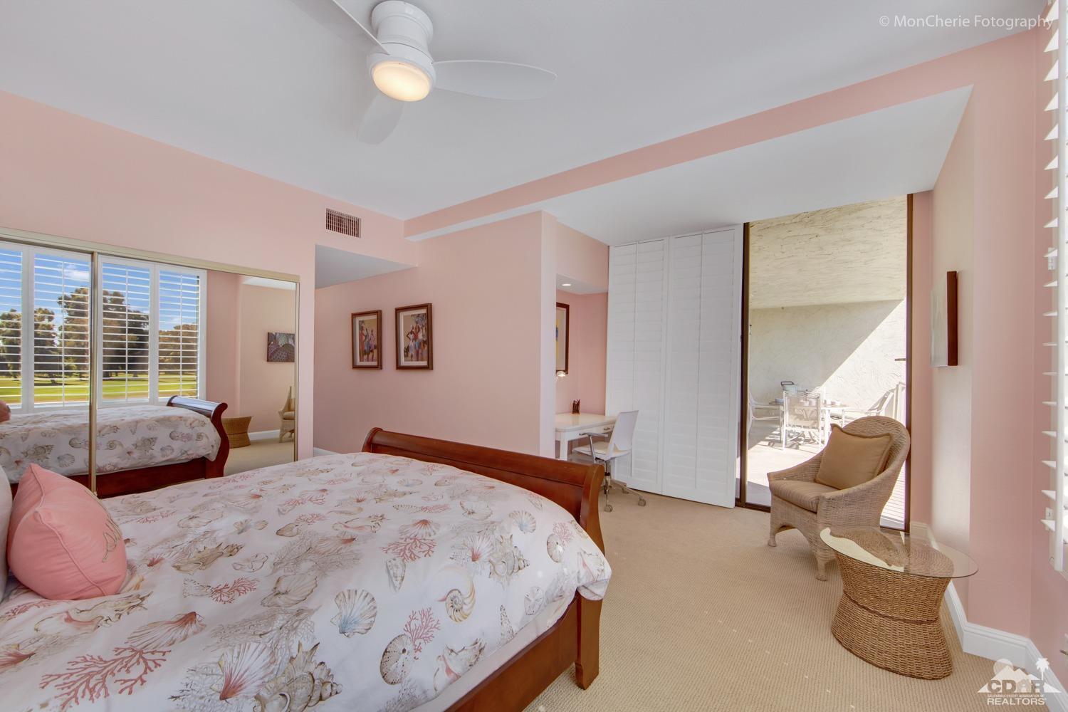 910 Island Drive, Unit 211 Rancho Mirage, CA 92270 - Photo 26 of 38 a bedroom with a bed and balcony