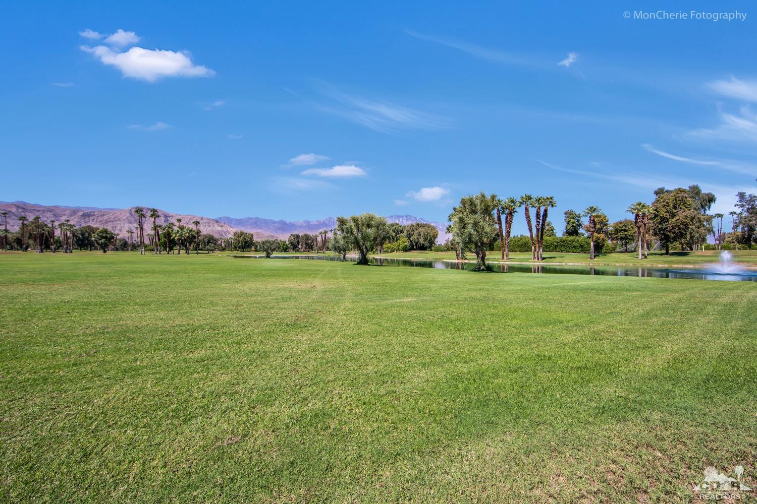 910 Island Drive, Unit 211 Rancho Mirage, CA 92270 - Photo 33 of 38 a view of a field with houses in background