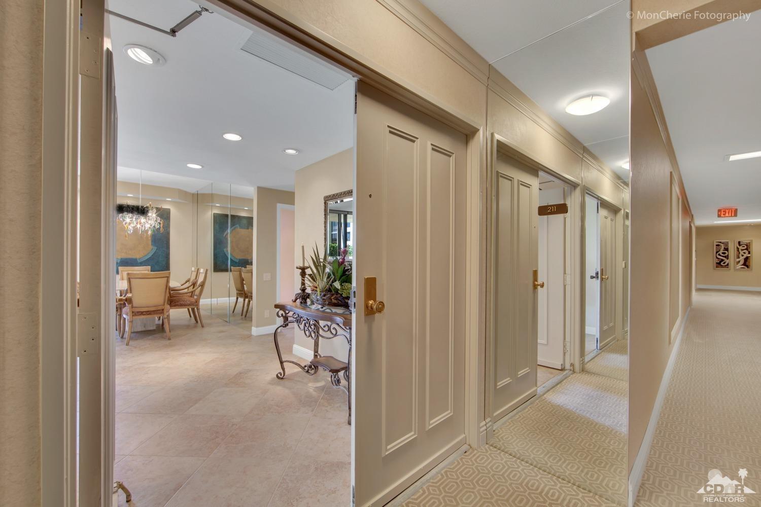 910 Island Drive, Unit 211 Rancho Mirage, CA 92270 - Photo 6 of 38 a lobby with furniture and a livingroom