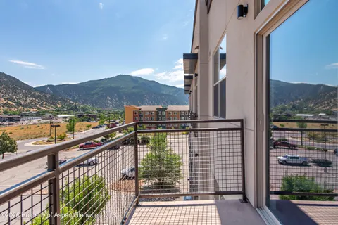 a view of city and mountain from a balcony