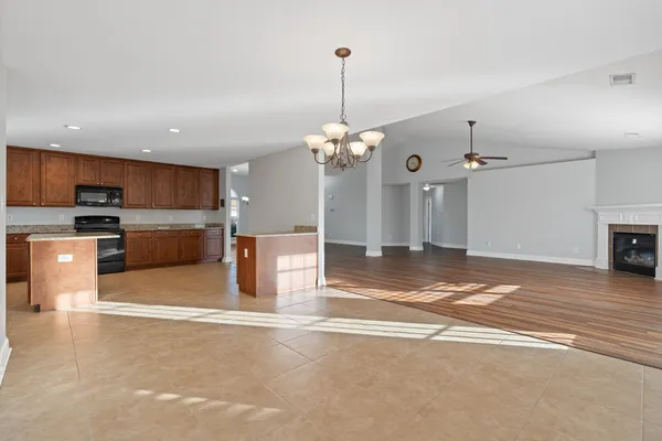 a view of a kitchen with a sink and cabinets