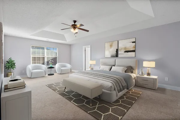 a spacious bedroom with a bed and a chandelier