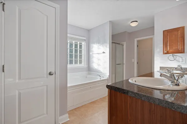 a bathroom with a sink double vanity and a mirror