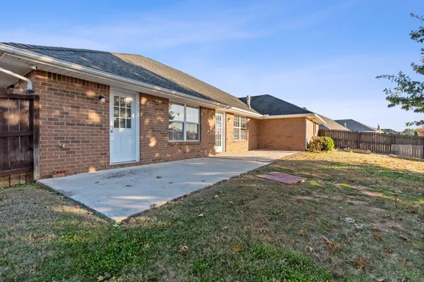 a view of front door and yard