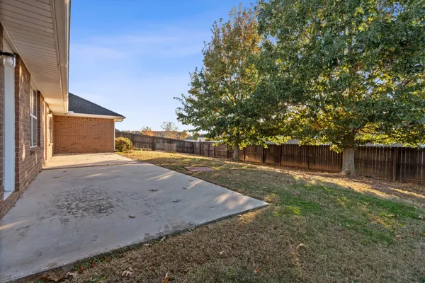 a view of a backyard of the house