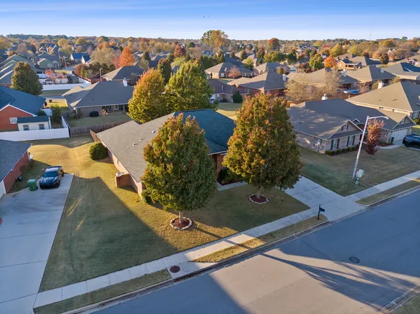 an aerial view of residential houses with outdoor space