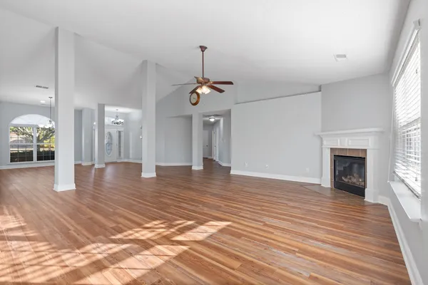 a view of a room wooden floor and fire pit