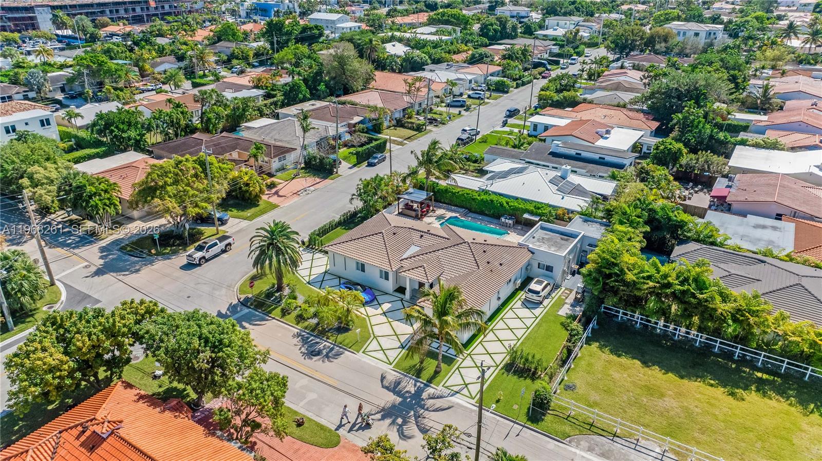 500 94th Street Surfside, FL 33154 - Photo 1 of 47 an aerial view of residential houses with outdoor space and swimming pool