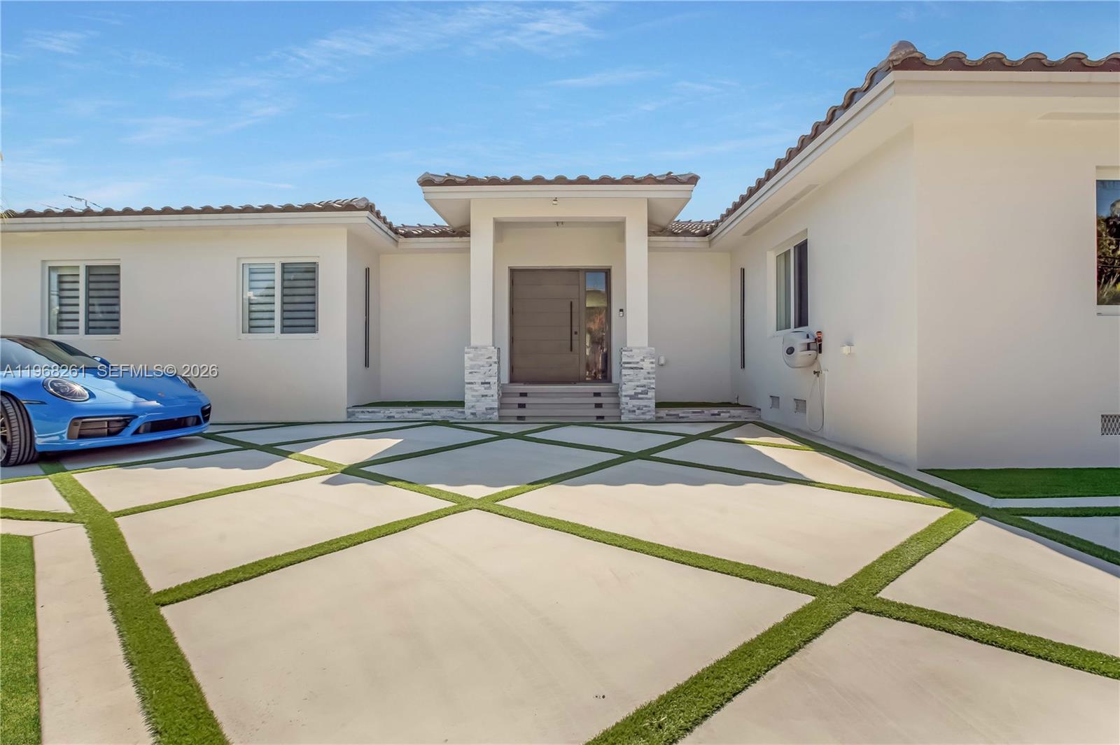 500 94th Street Surfside, FL 33154 - Photo 11 of 47 a house with swimming pool in front of it