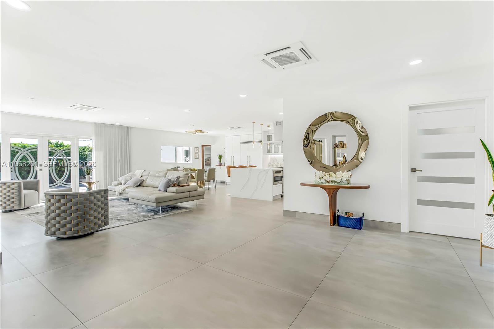 500 94th Street Surfside, FL 33154 - Photo 12 of 47 a living room with furniture and a mirror