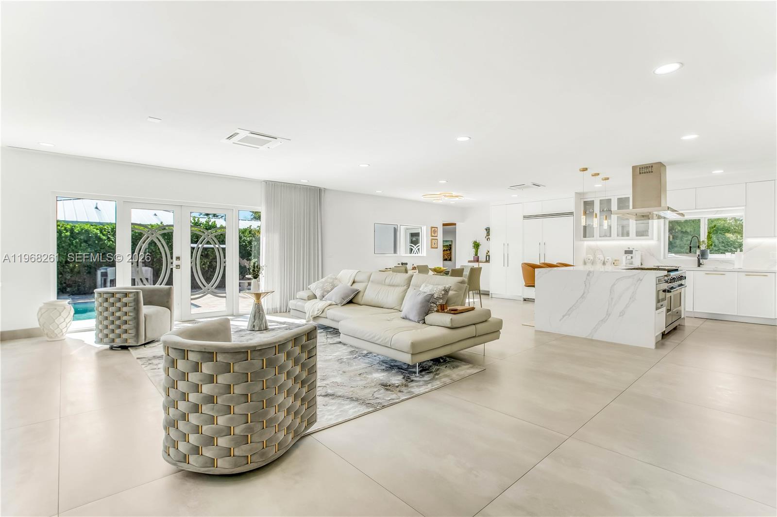500 94th Street Surfside, FL 33154 - Photo 13 of 47 a living room with furniture and a large window