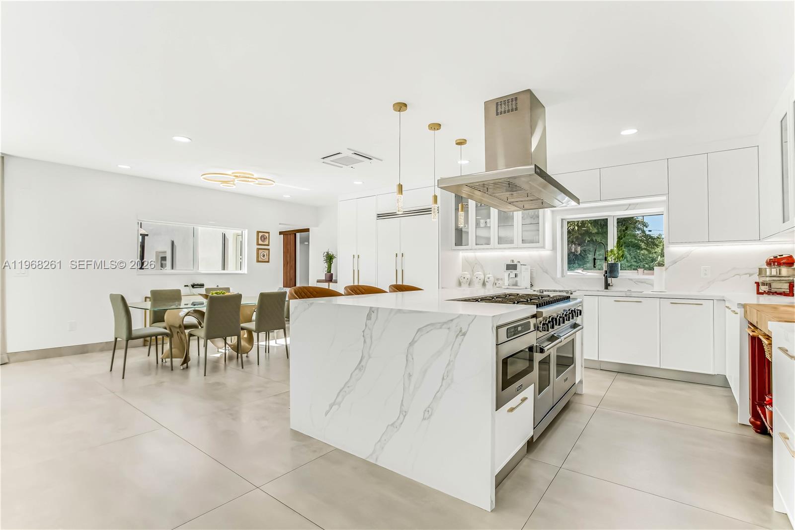 500 94th Street Surfside, FL 33154 - Photo 16 of 47 a kitchen with stove and cabinets