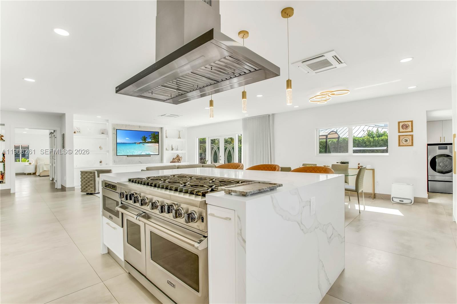 500 94th Street Surfside, FL 33154 - Photo 17 of 47 a kitchen with a stove and a view of kitchen