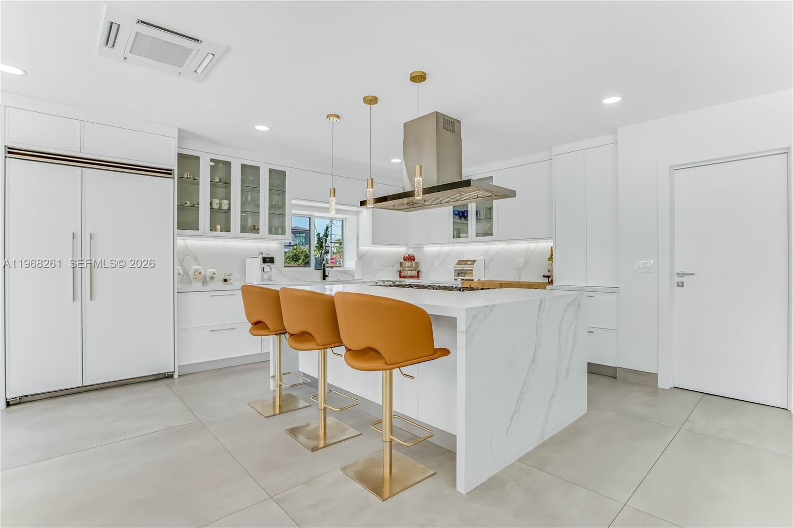 500 94th Street Surfside, FL 33154 - Photo 18 of 47 a kitchen with a sink cabinets and window