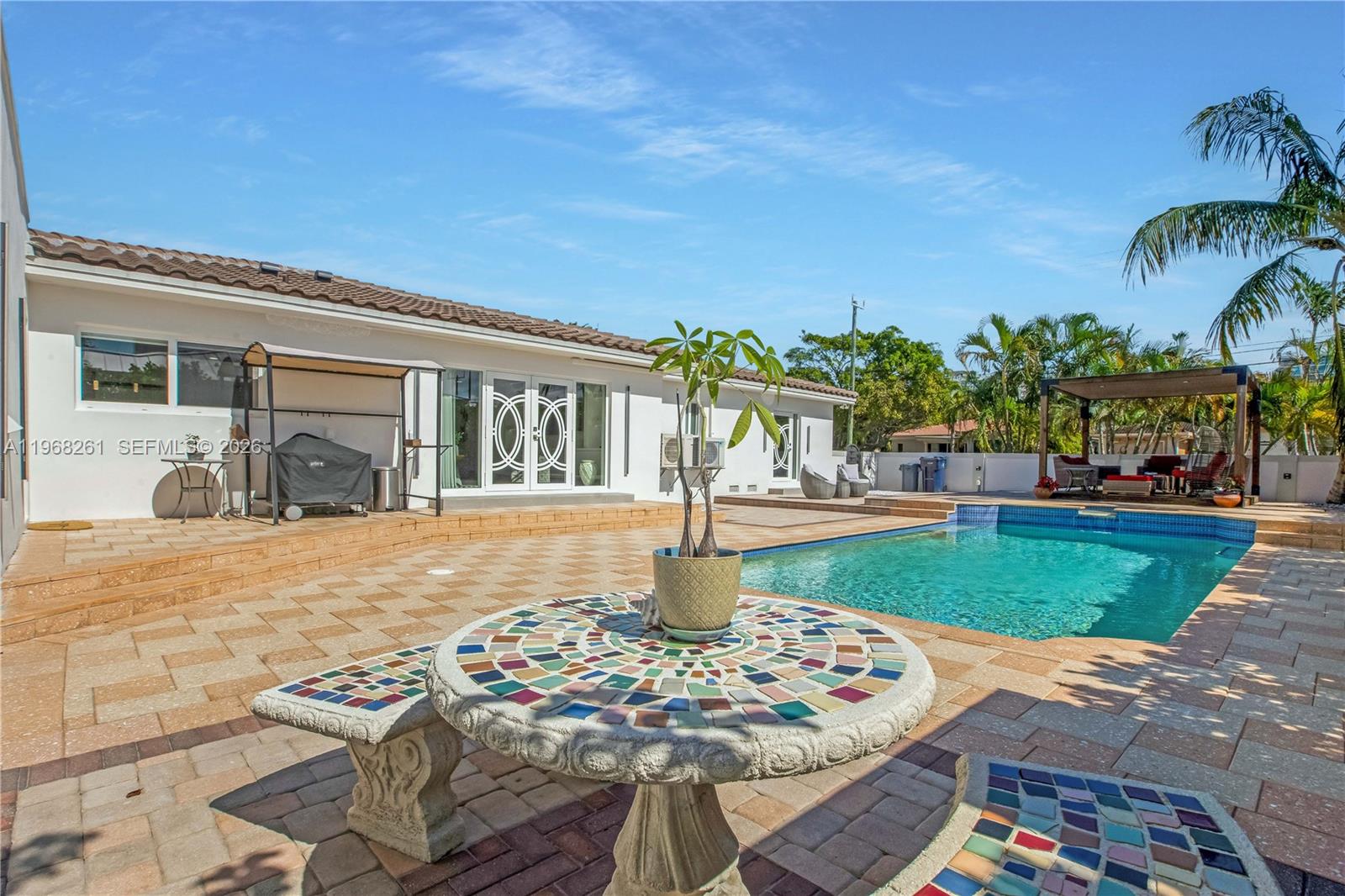 500 94th Street Surfside, FL 33154 - Photo 20 of 47 a front view of a house with garden