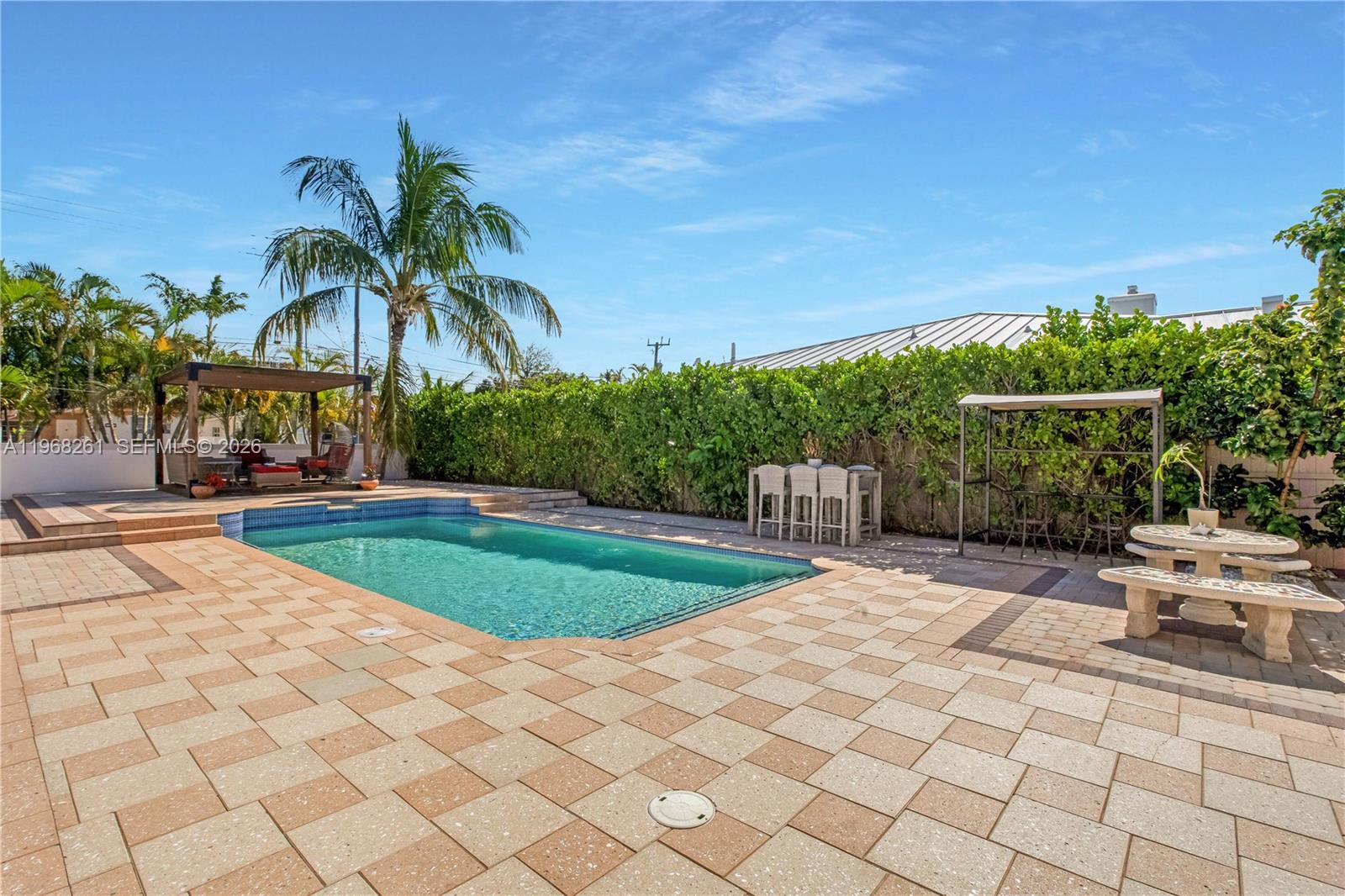 500 94th Street Surfside, FL 33154 - Photo 23 of 47 a view of a backyard