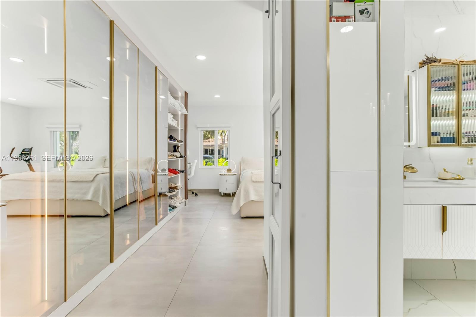 500 94th Street Surfside, FL 33154 - Photo 30 of 47 a view of a bathroom with tub shower and sink