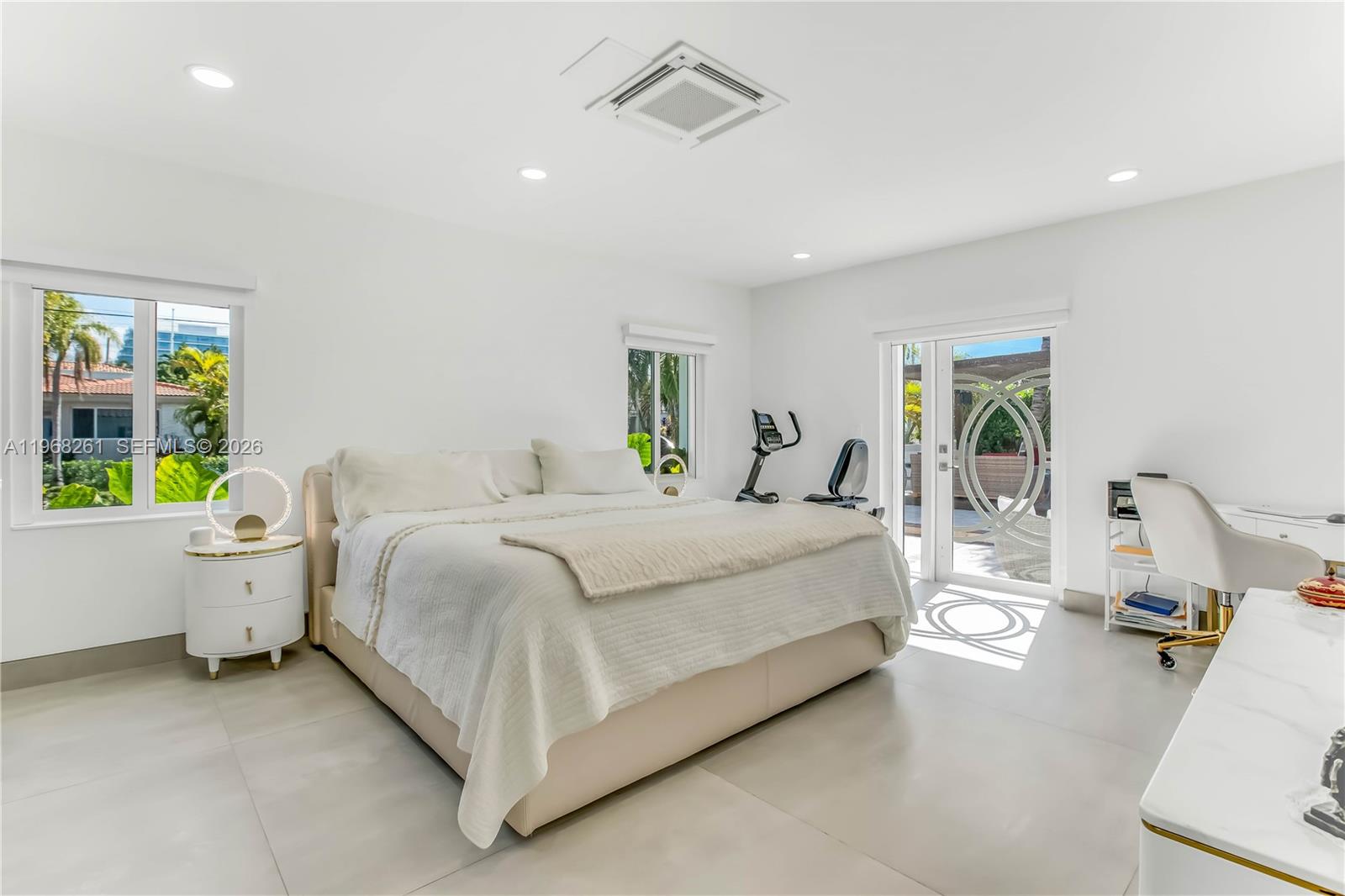 500 94th Street Surfside, FL 33154 - Photo 31 of 47 a bed room with a bed and a couch