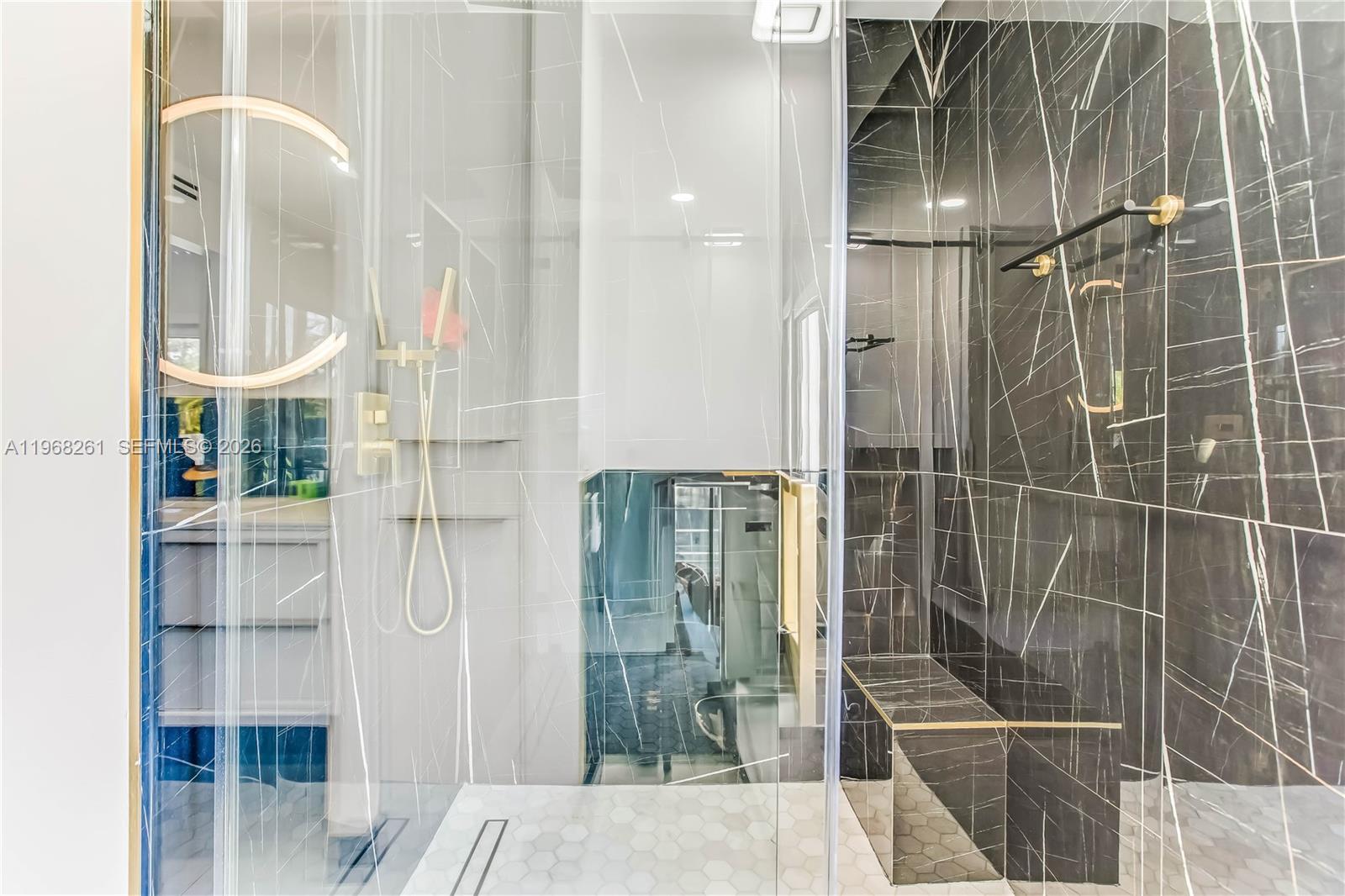 500 94th Street Surfside, FL 33154 - Photo 37 of 47 a bathroom with a glass shower door and a sink