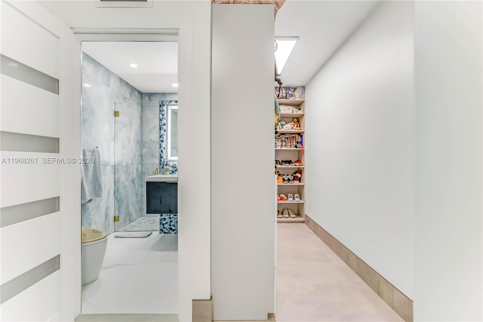 500 94th Street Surfside, FL 33154 - Photo 39 of 47 a view of a hallway with workspace and living room