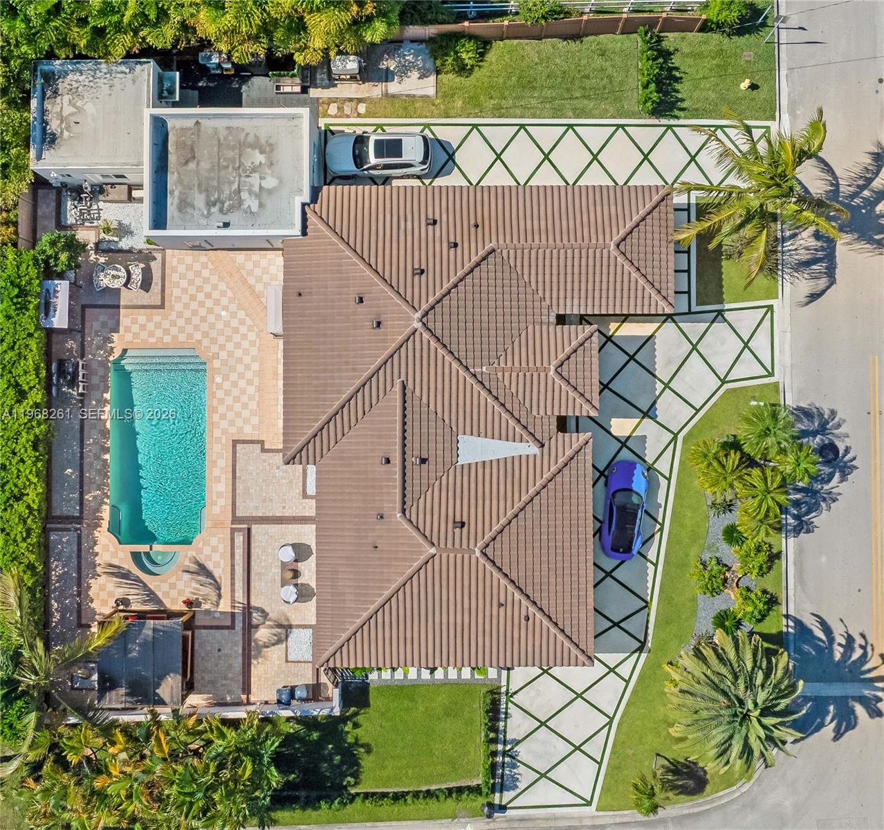 500 94th Street Surfside, FL 33154 - Photo 4 of 47 an aerial view of a house with a yard and potted plants