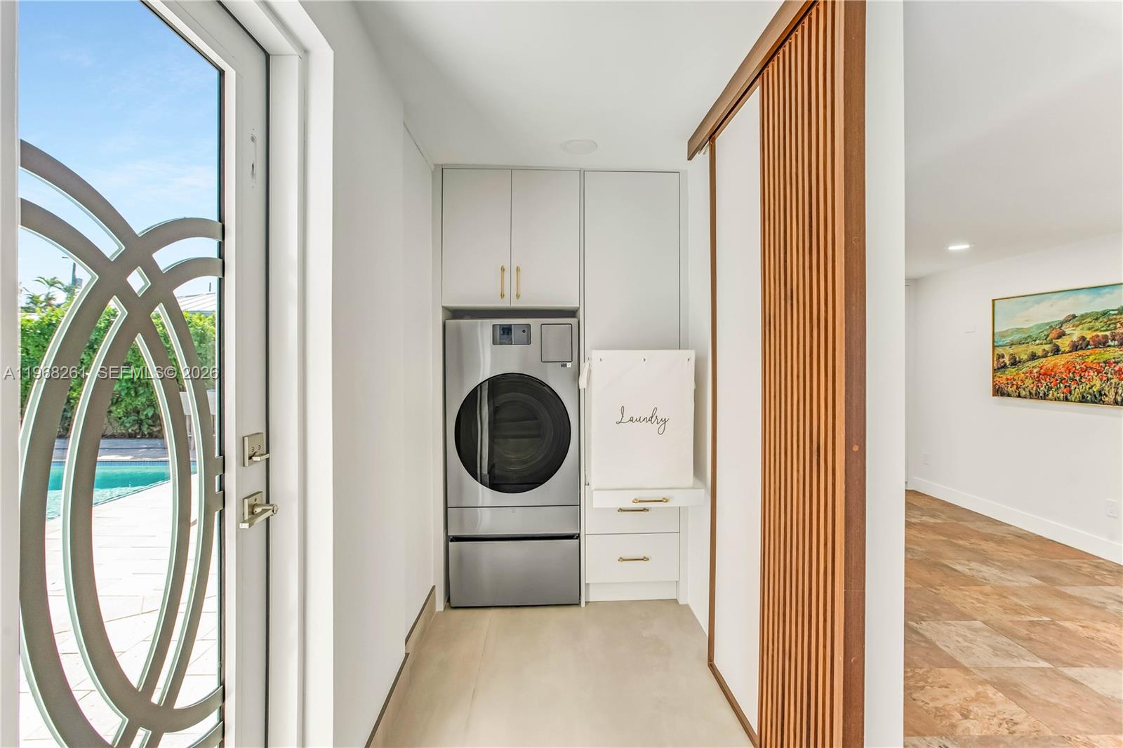 500 94th Street Surfside, FL 33154 - Photo 41 of 47 a view of a hallway with washer and dryer