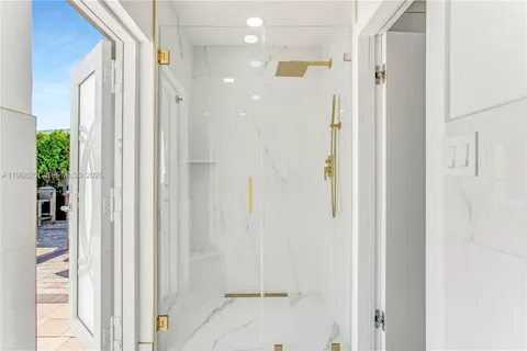 a view of a door and a window