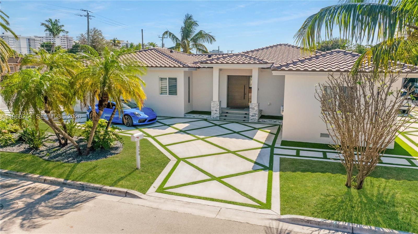 500 94th Street Surfside, FL 33154 - Photo 7 of 47 a view of a house with backyard and sitting area