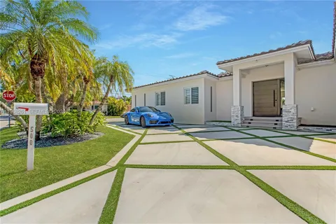 a house with swimming pool in front of it