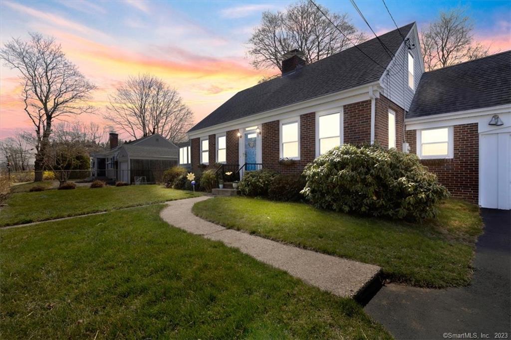 21 Richards Grove Road Waterford, CT 06375 - Photo 1 of 1 a front view of house with yard and green space