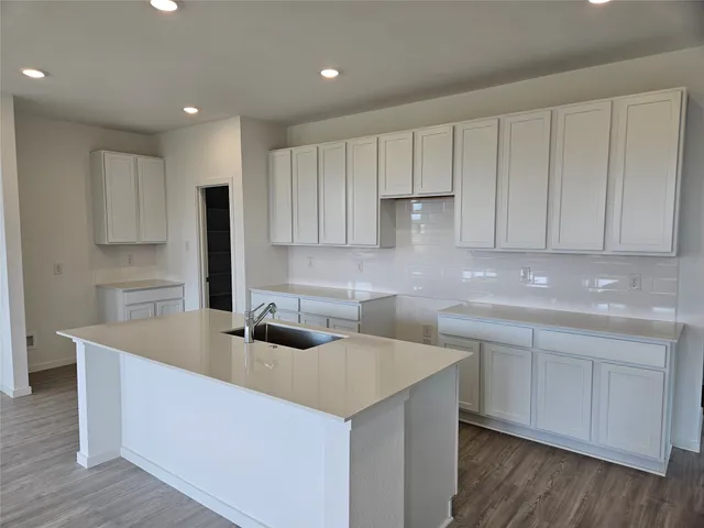 a kitchen with cabinets a sink and dishwasher