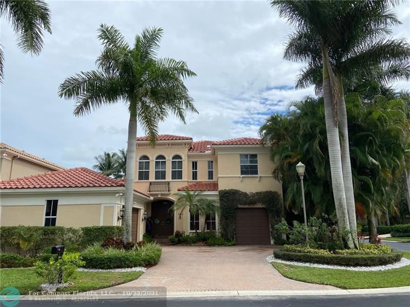 16080 Bristol Isle Way Delray Beach, FL 33446 - Photo 1 of 11 a front view of a house with a garden