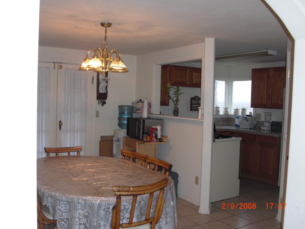 3851 Hudson Road Outlook, WA 98938 - Photo 3 of 7 a dining room with stainless steel appliances kitchen island granite countertop furniture and a chandelier