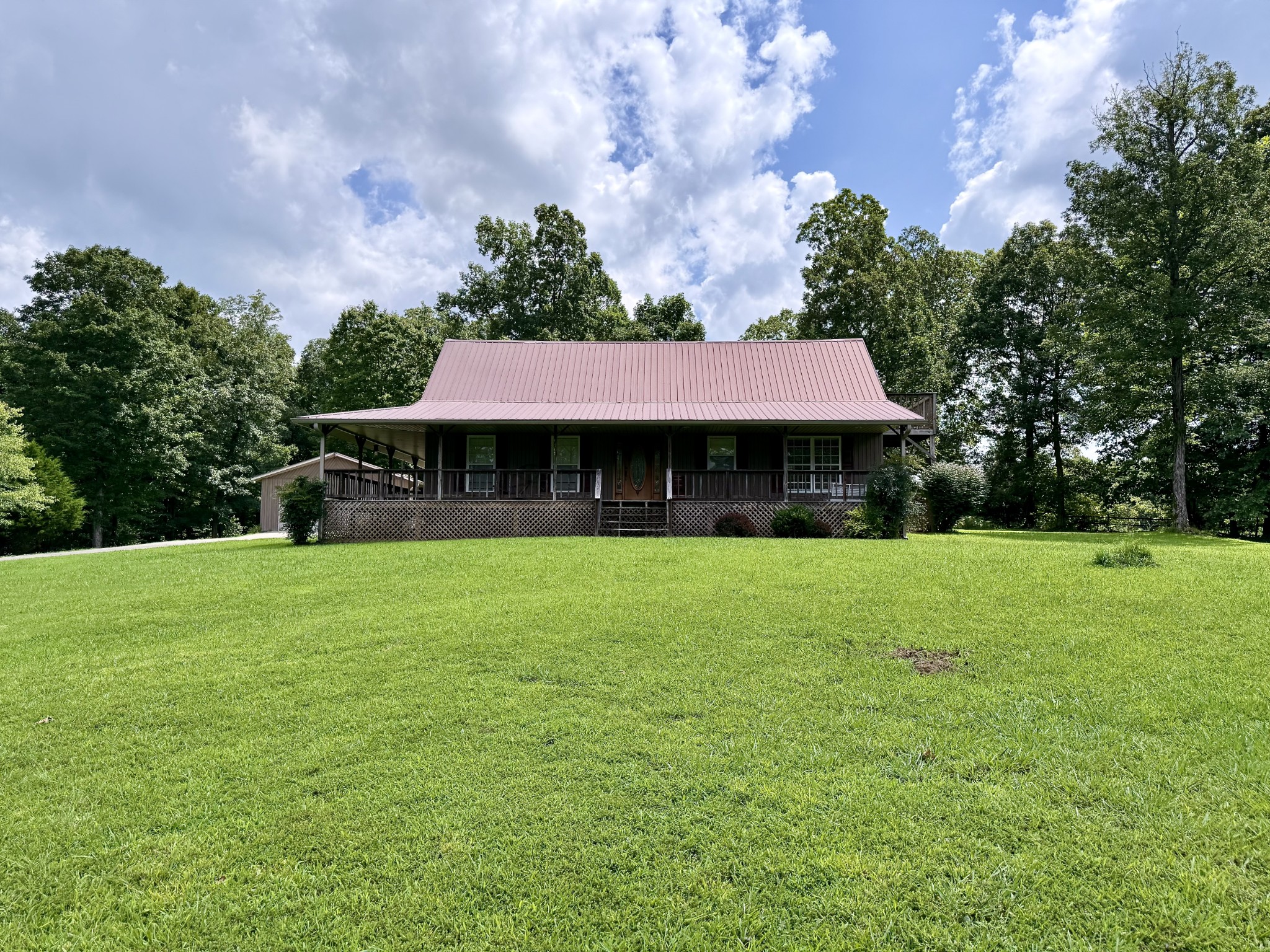 1086 Brown Mill Road McEwen, TN 37101 - Photo 1 of 44 a front view of a house with garden
