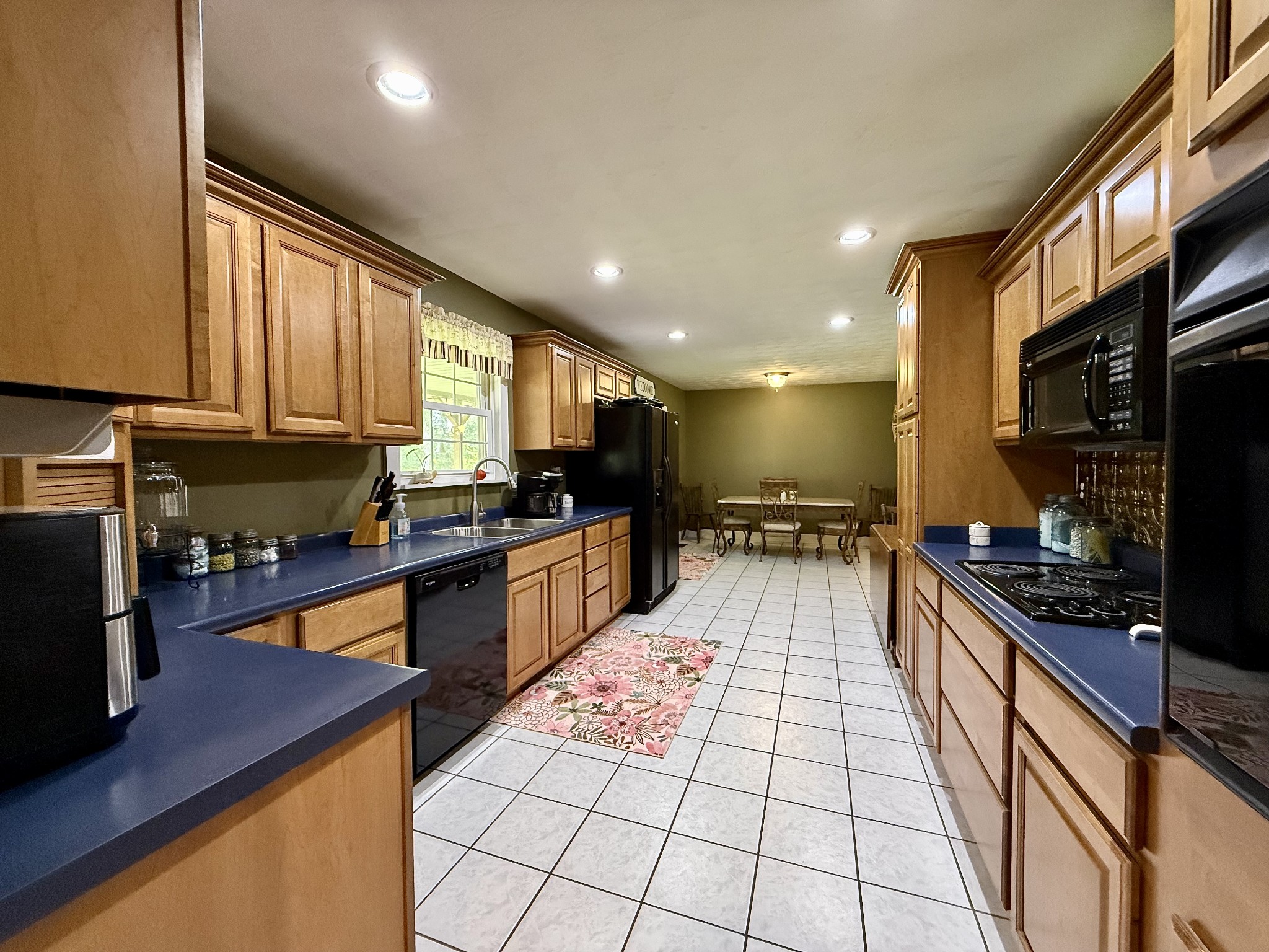1086 Brown Mill Road McEwen, TN 37101 - Photo 18 of 44 a kitchen with stainless steel appliances granite countertop a sink stove and refrigerator