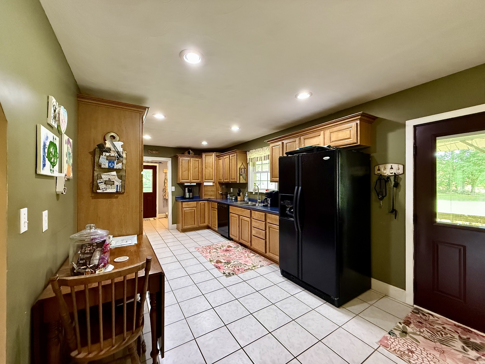 1086 Brown Mill Road McEwen, TN 37101 - Photo 19 of 44 a kitchen with stainless steel appliances kitchen island granite countertop a refrigerator and a stove