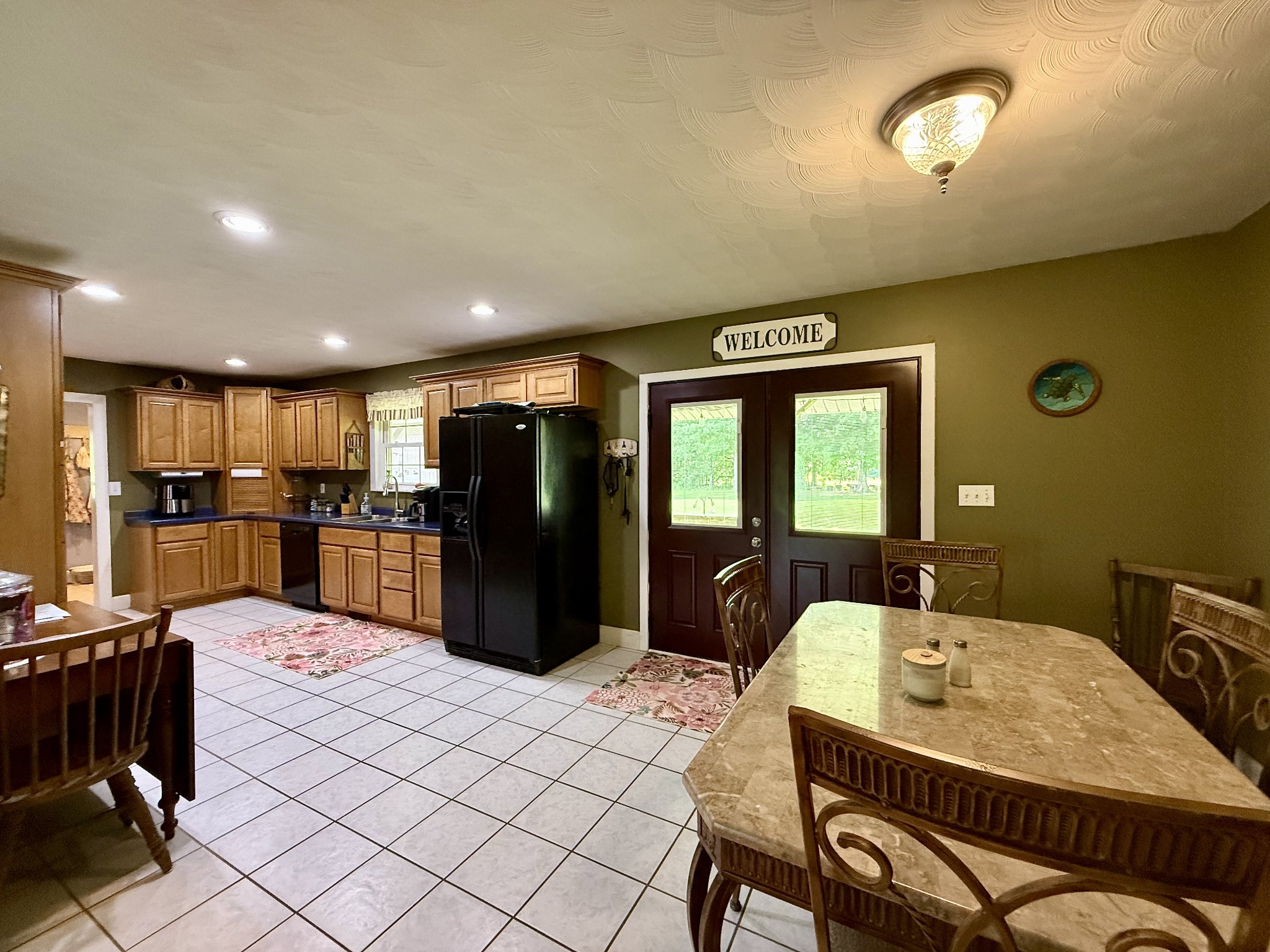 1086 Brown Mill Road McEwen, TN 37101 - Photo 20 of 44 a living room with stainless steel appliances furniture a dining table and kitchen view