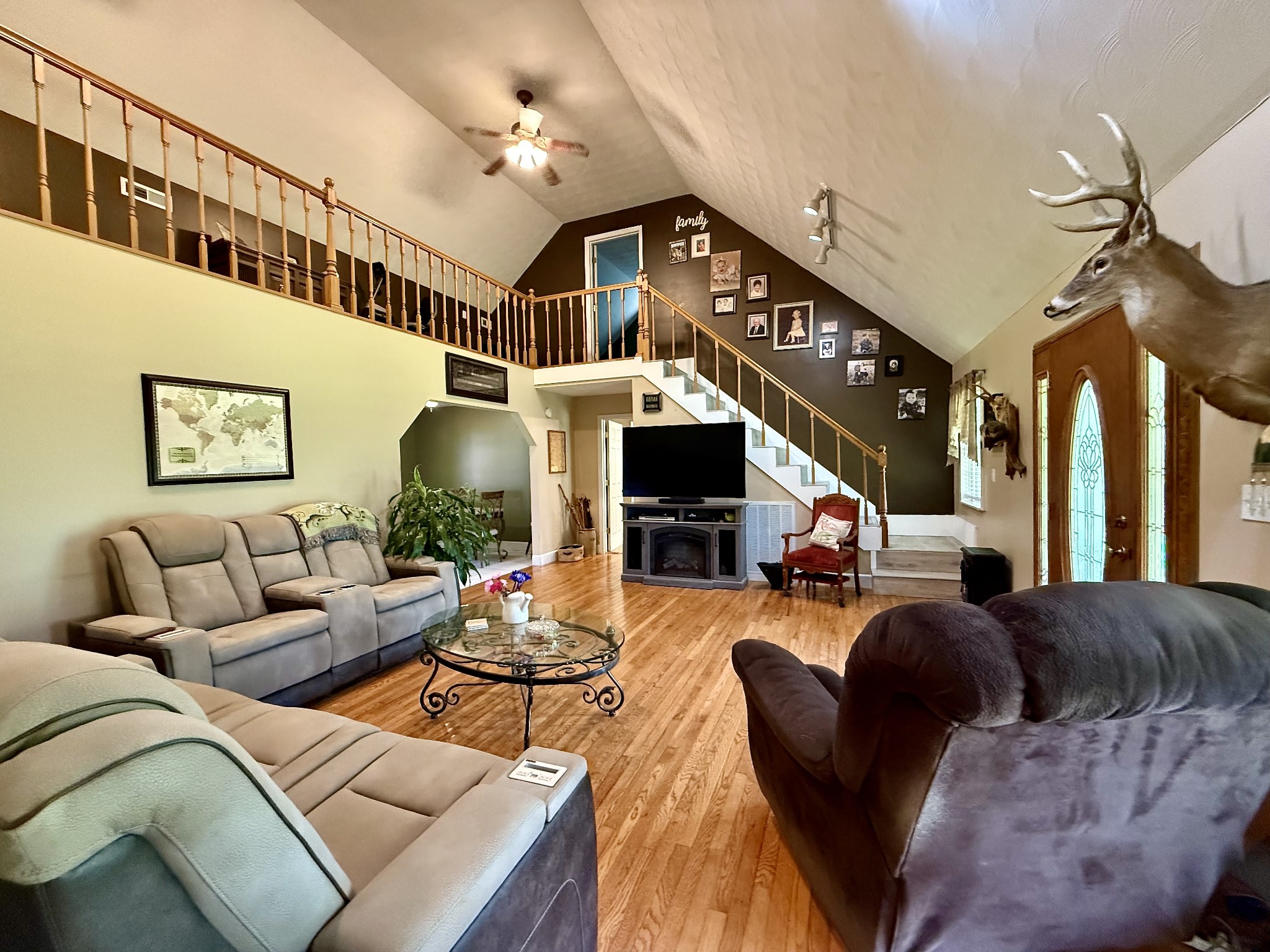 1086 Brown Mill Road McEwen, TN 37101 - Photo 28 of 44 a living room with furniture a fireplace and a chandelier