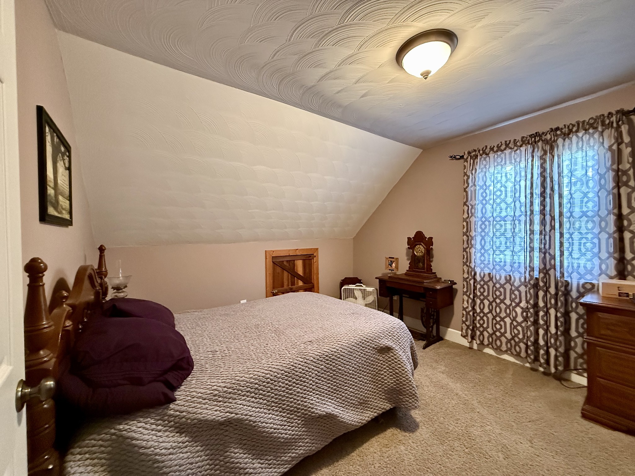 1086 Brown Mill Road McEwen, TN 37101 - Photo 34 of 44 a bedroom with a bed and a window