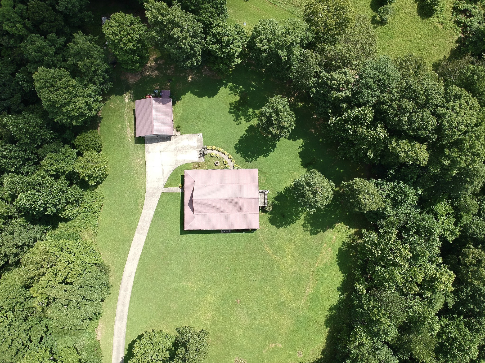 1086 Brown Mill Road McEwen, TN 37101 - Photo 4 of 44 an aerial view of a house with swimming pool and garden