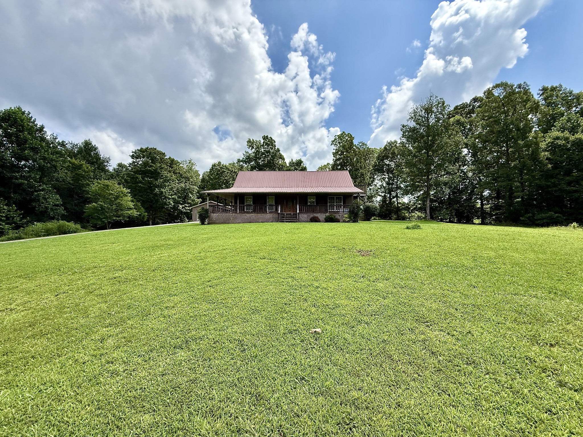 1086 Brown Mill Road McEwen, TN 37101 - Photo 42 of 44 a view of a lake with a house in the background