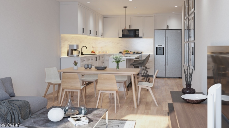 29 Frederick Street, Unit 2 Belleville, NJ 07109 - Photo 2 of 6 a kitchen with stainless steel appliances kitchen island granite countertop a refrigerator and microwave